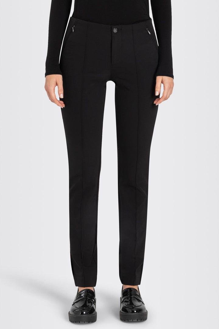Black pants worn by a person on a white background