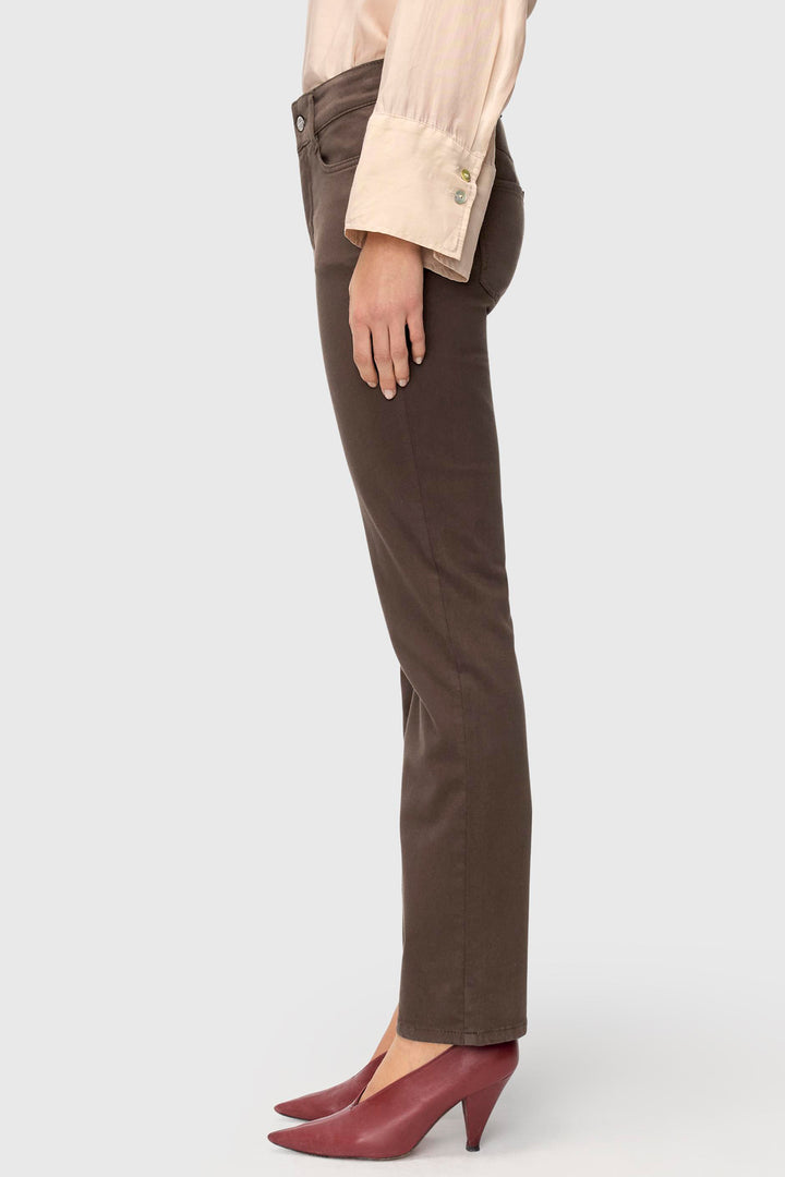 Brown pants worn by a person on a white background