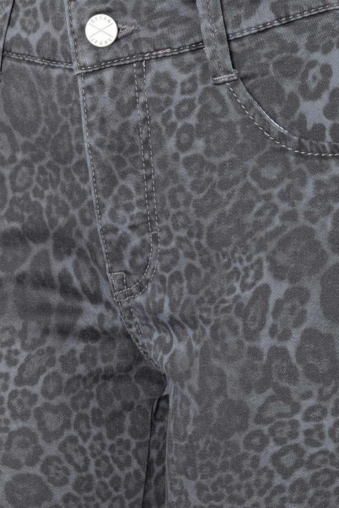 Close-up of gray pants with a subtle leopard print pattern.