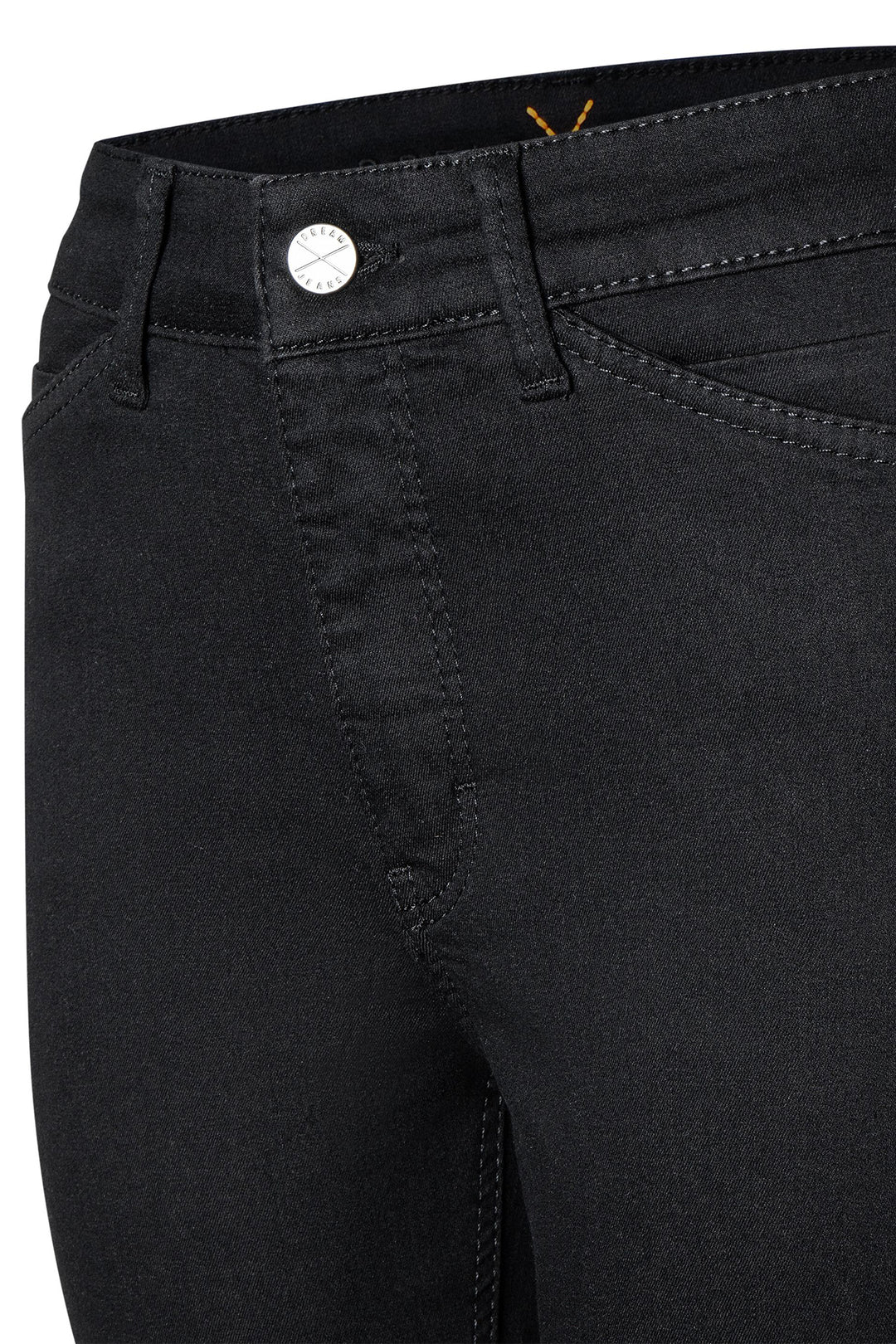 Close-up of black pants with a button detail on a white background