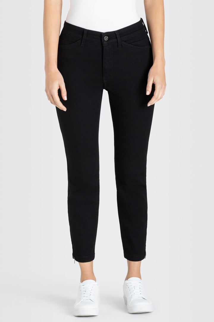 Person wearing black pants on a white background