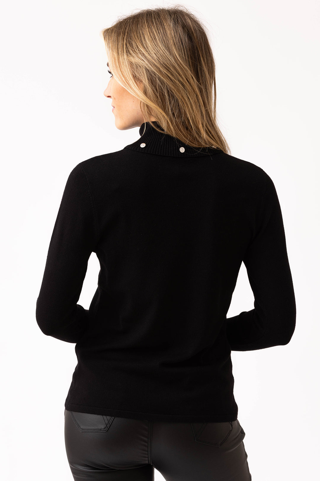 Woman wearing a black turtleneck sweater on a white background