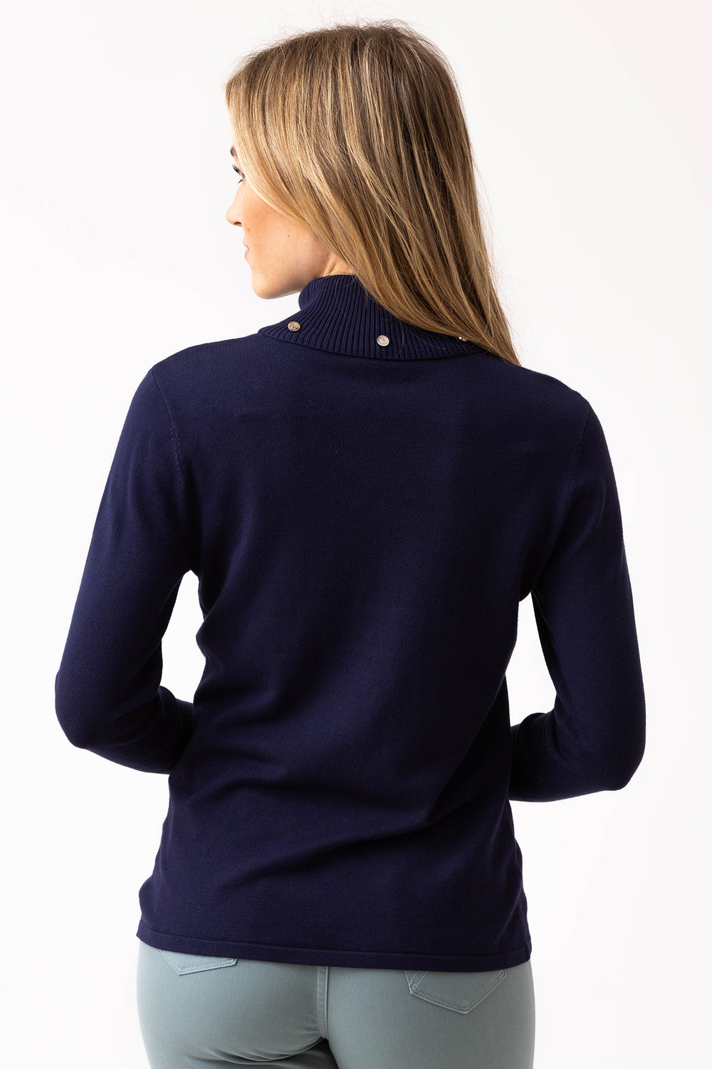 Woman wearing a navy blue sweater on a white background