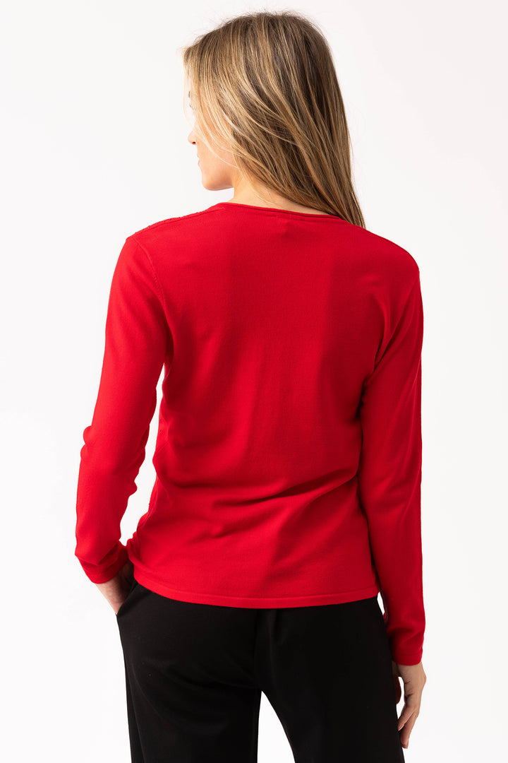 Person wearing a red long-sleeve shirt on a white background