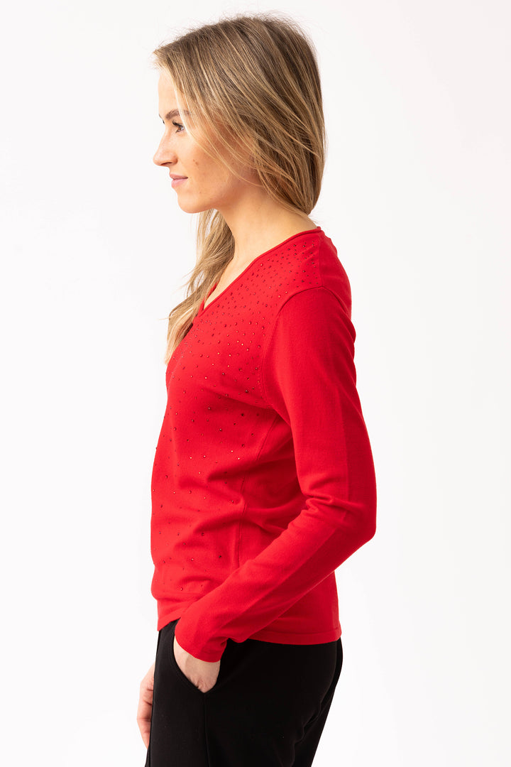 Woman wearing a red sweater on a white background