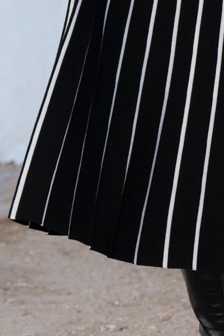 Black and white striped skirt with a blurred background