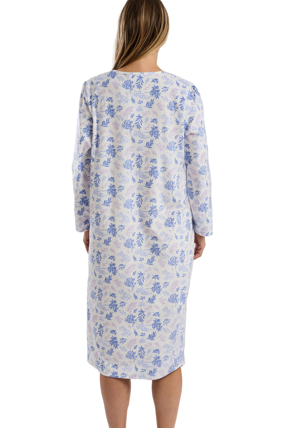 Woman wearing a floral nightgown on a white background