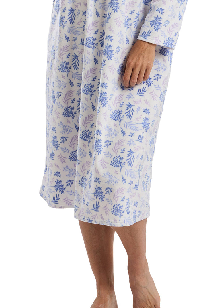 Floral patterned nightgown worn by a person on a white background