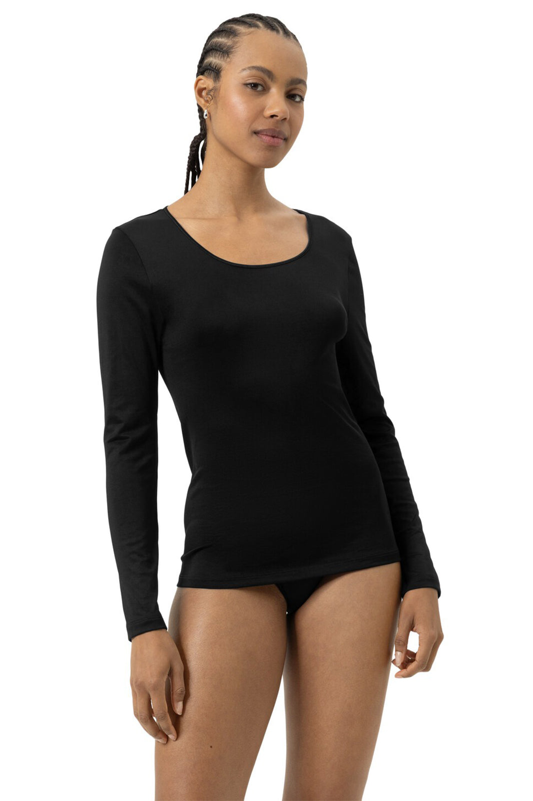 Woman wearing a black long-sleeve top on a white background