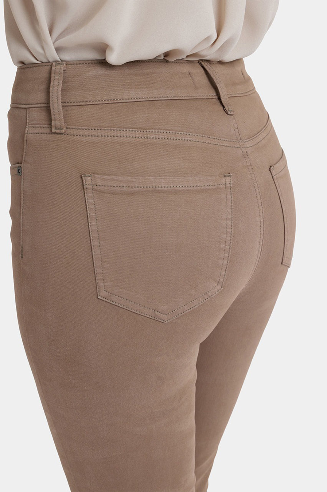 Brown pants with a pocket detail on a white background