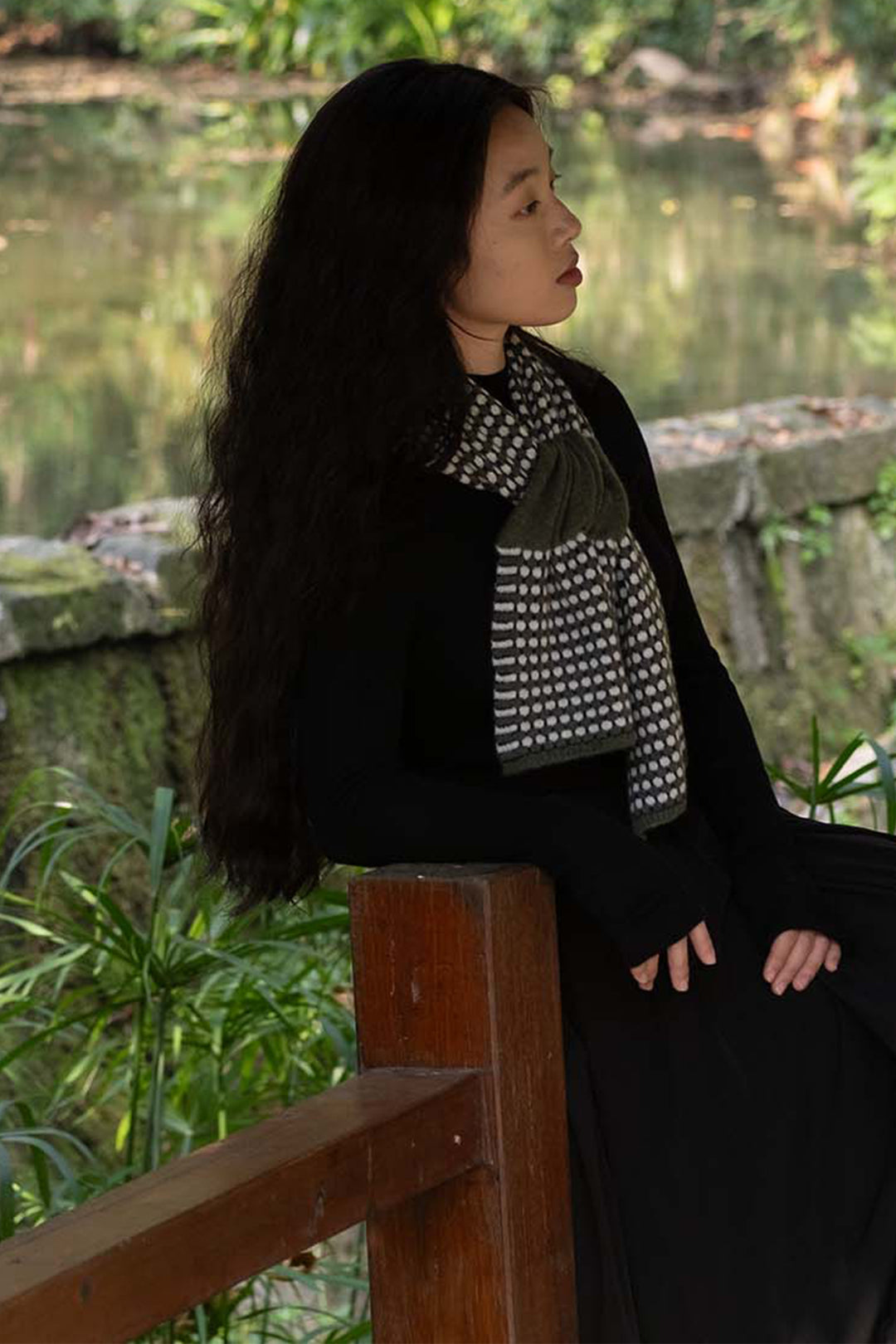 Oats &amp; Rice Coral Green Cashmere Keyhole Scarf OR25-NS05, styled outdoors, side view