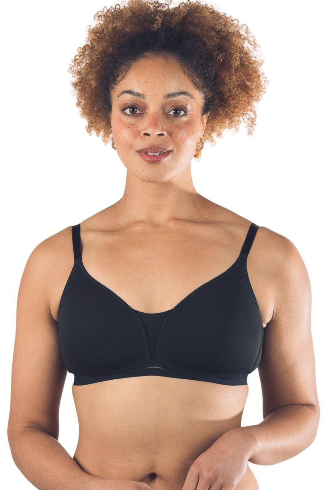 Woman wearing a black bra on a white background
