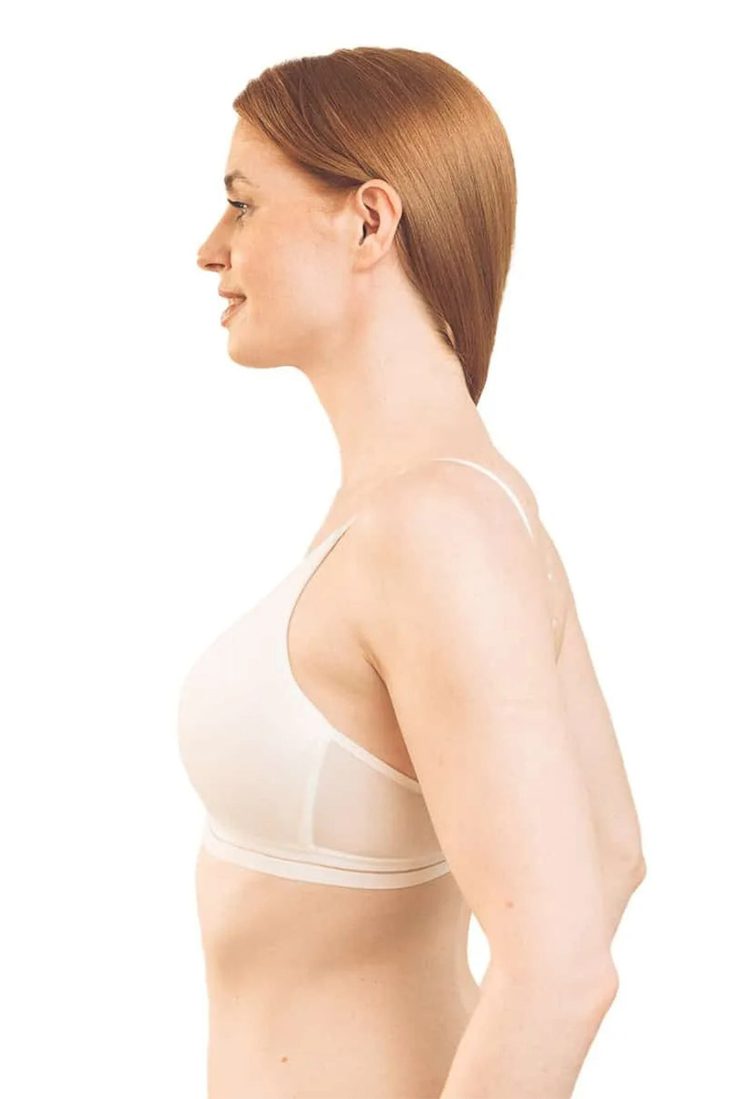 Woman wearing a beige bra on a white background