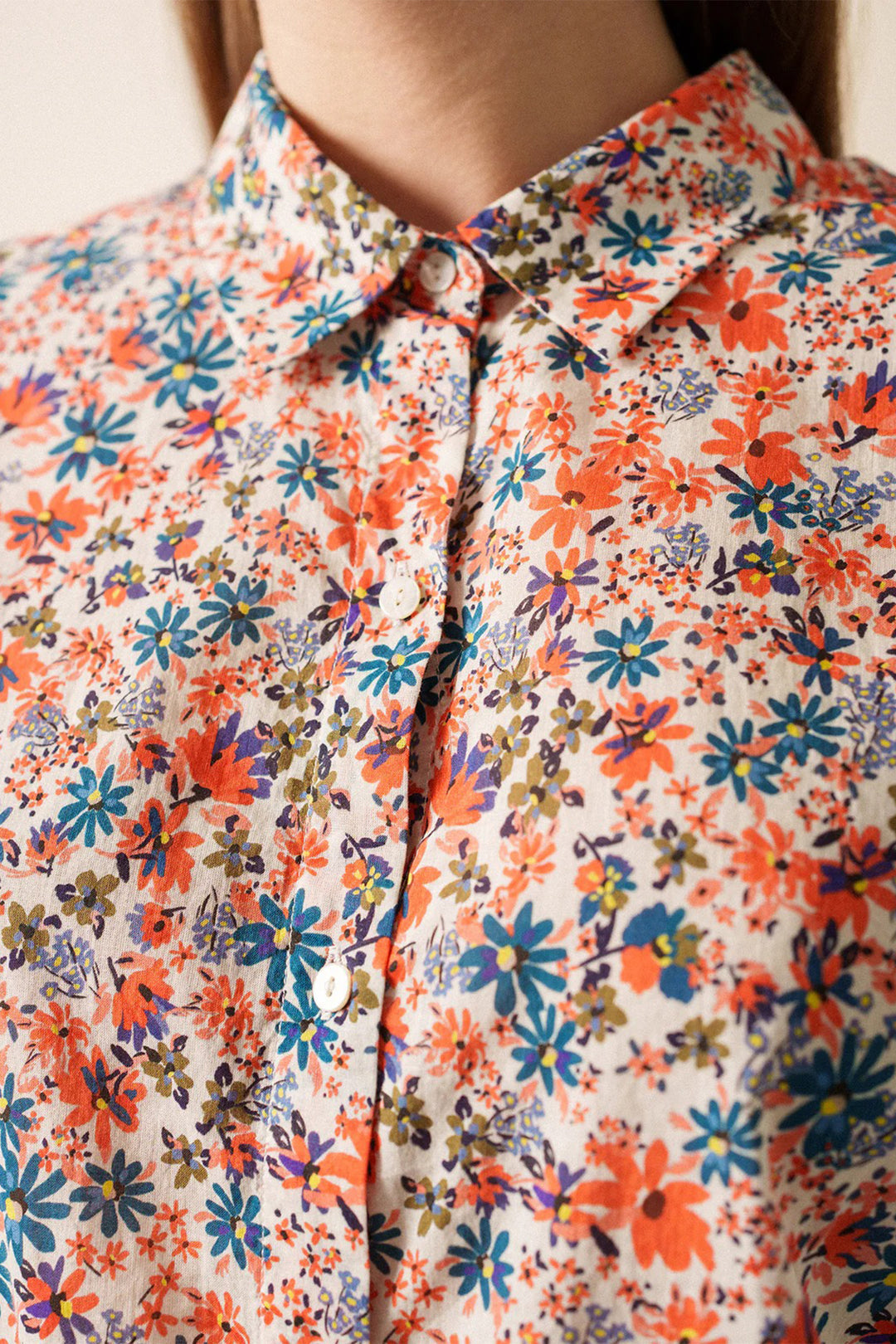 Close-up of a colorful floral shirt with a blurred background