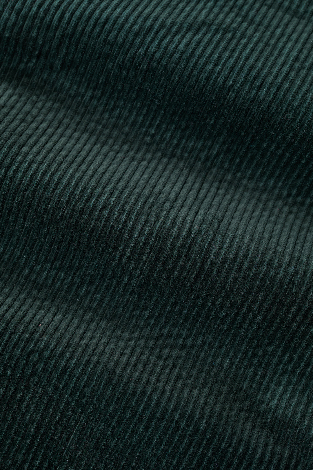 Close-up of dark green textured fabric