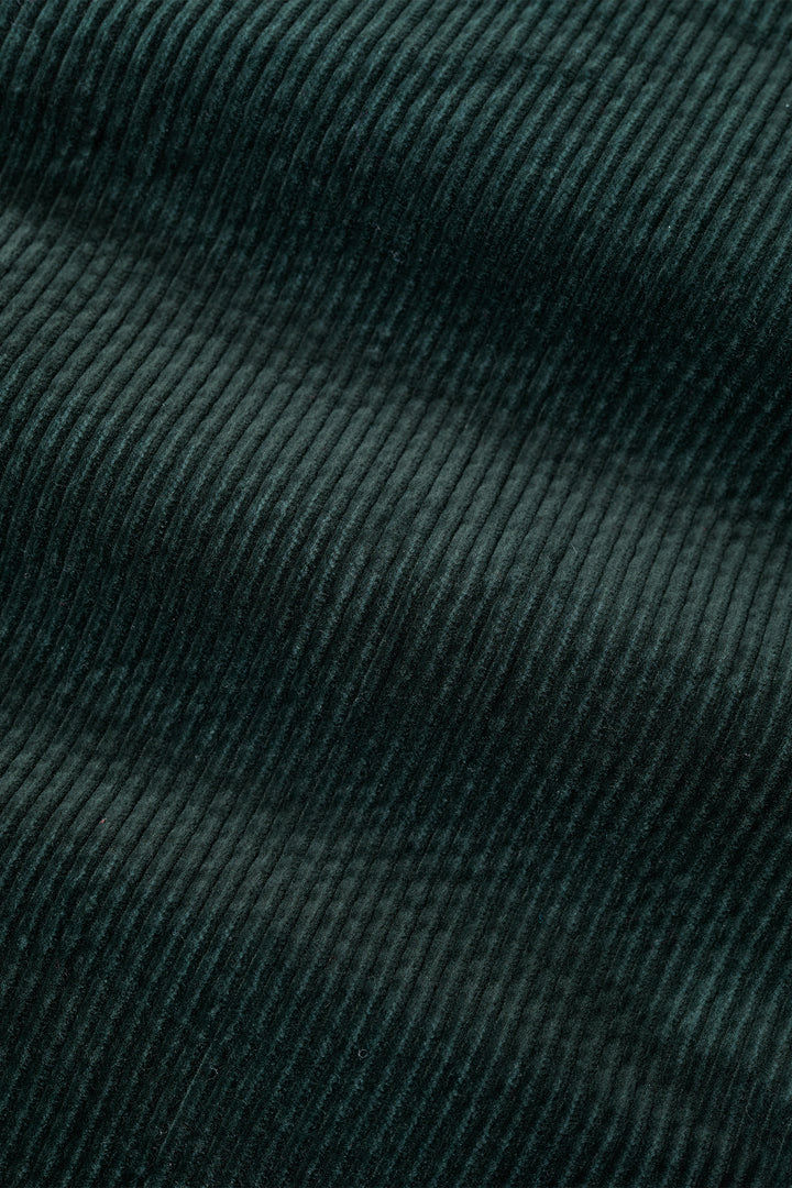 Close-up of dark green textured fabric