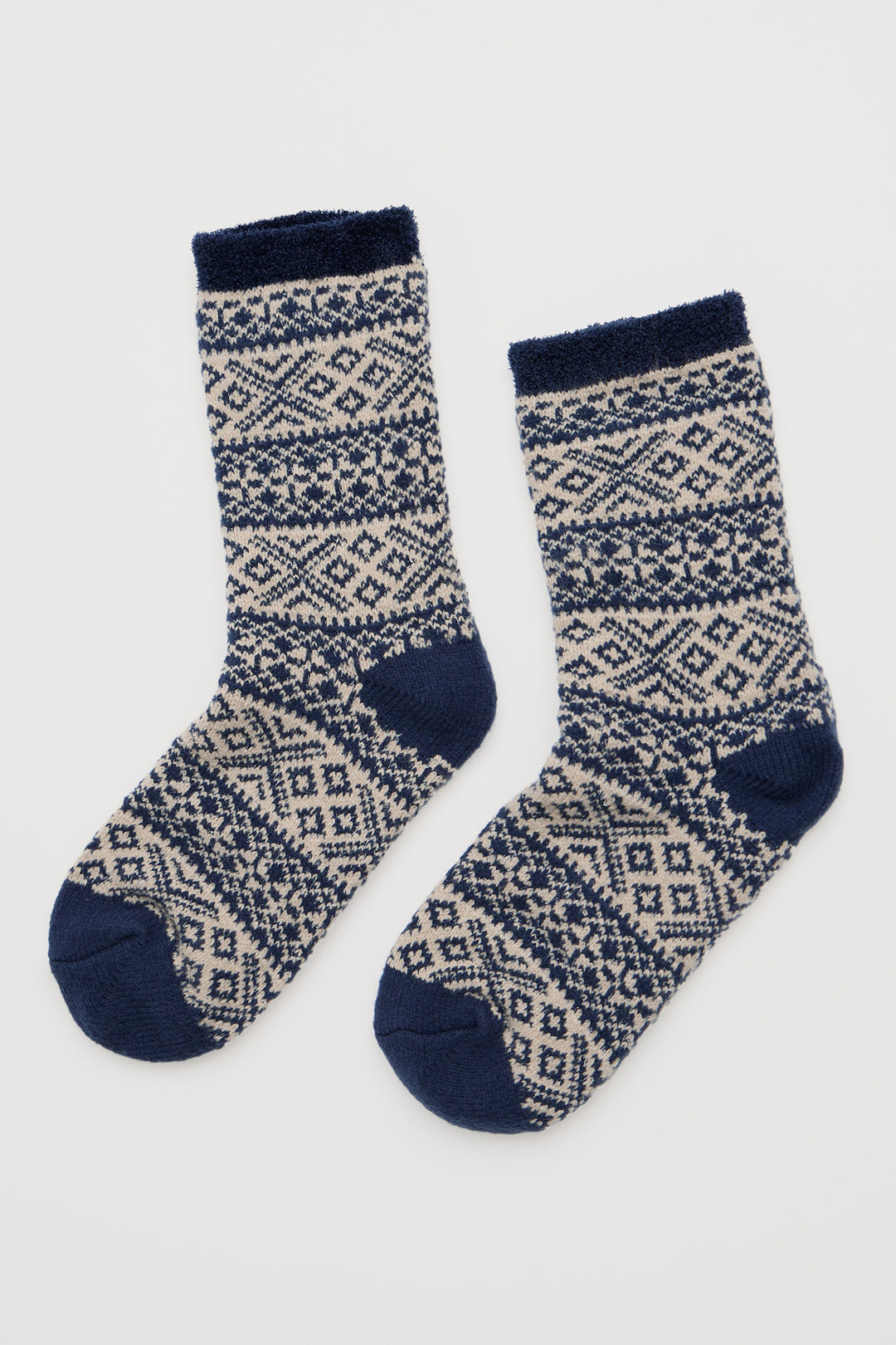 Pair of patterned socks with navy accents on a white background