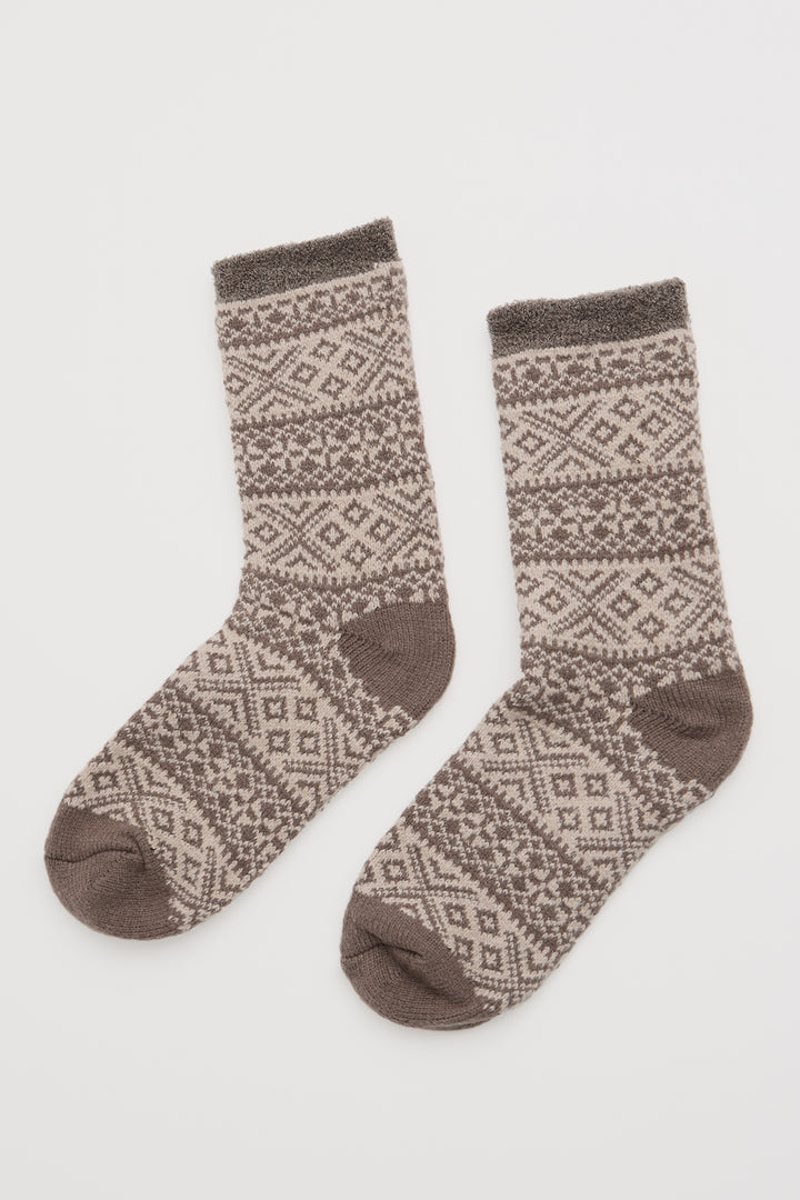 Pair of patterned socks on a light gray background