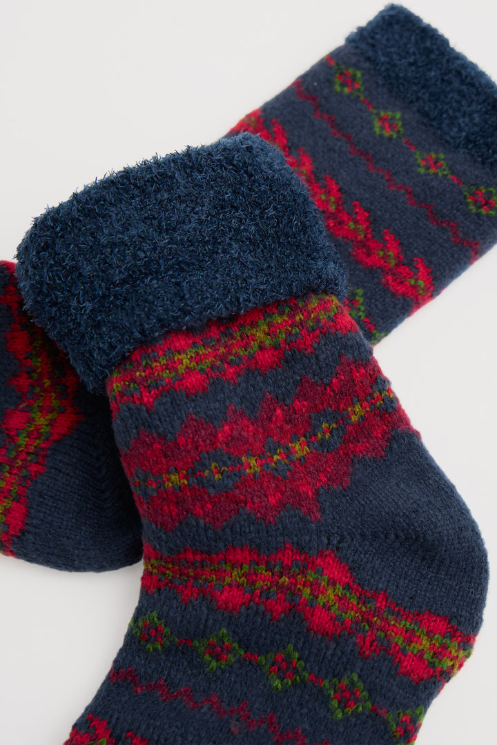 Pair of blue and red patterned socks on a white background