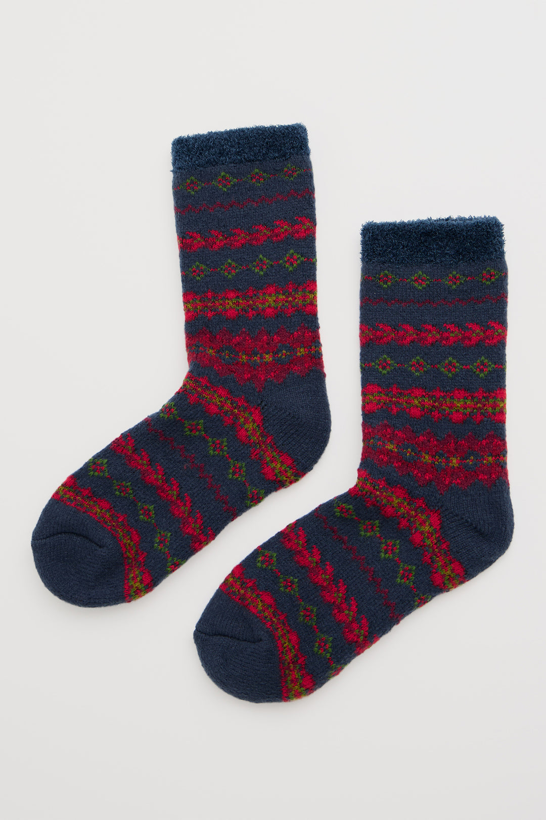 Pair of blue socks with red and green pattern on a white background
