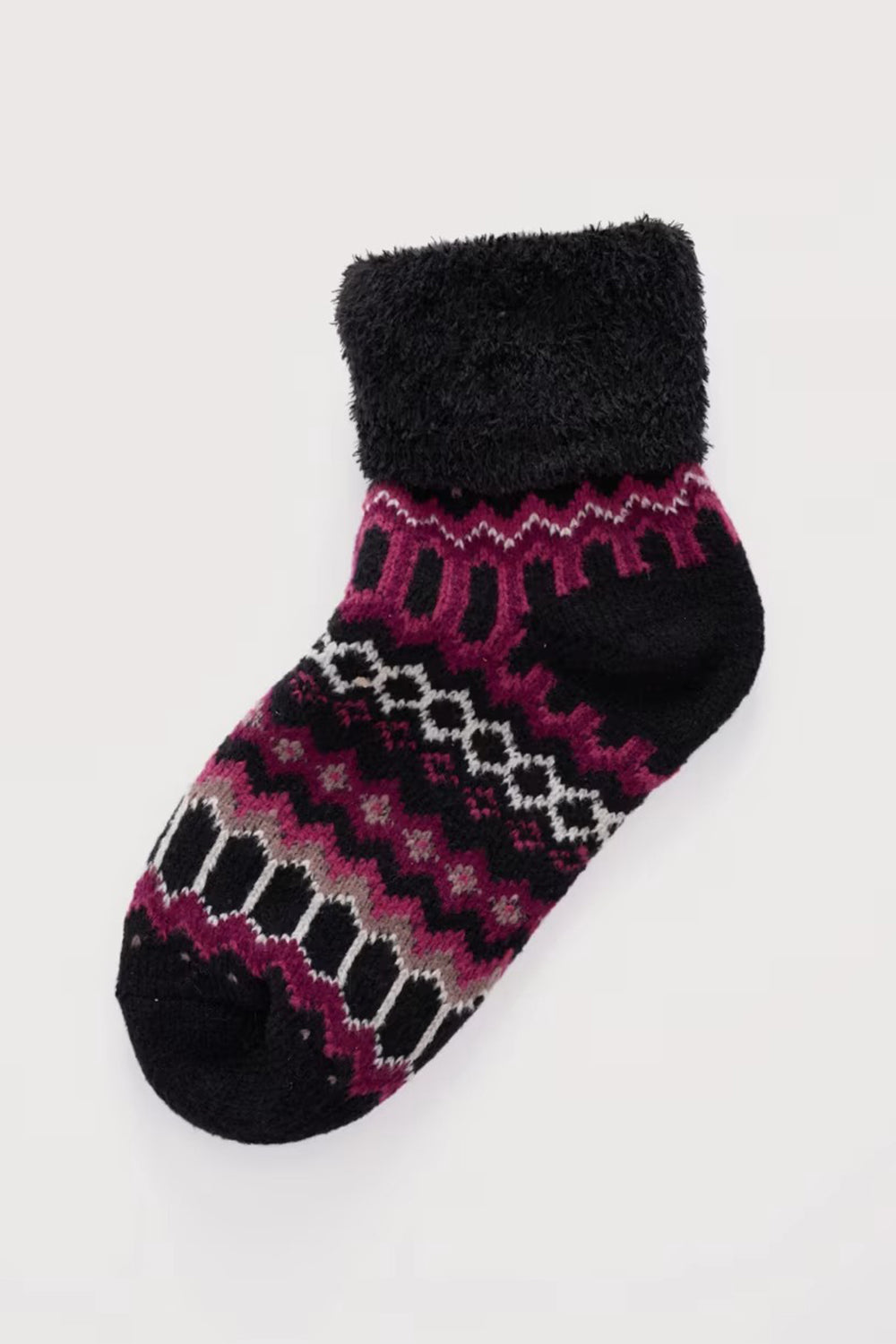 Black and purple patterned sock on a white background
