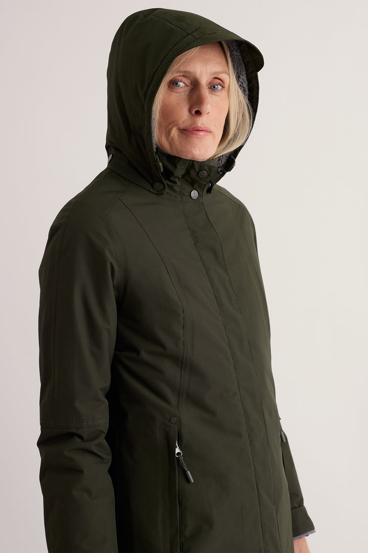 Seasalt Cornwall Janelle Woodland Green Waterproof Jacket, hood up on model