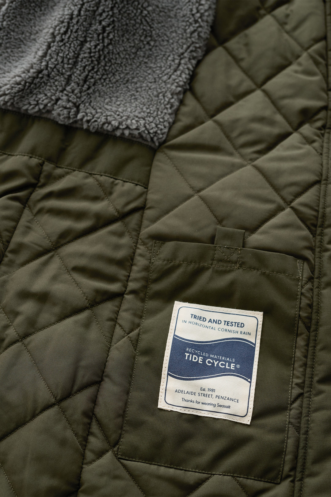 Seasalt Cornwall Janelle Woodland Green Waterproof Jacket, quilted lining and label close up