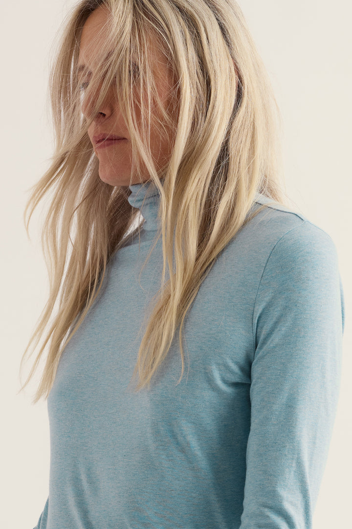 Seasalt Cornwall Landing Lichen Green Top, roll neck close up on model