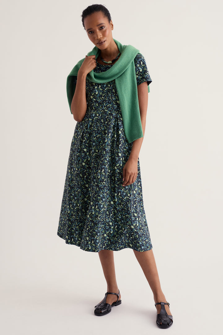 Seasalt Cornwall Veronica Garden Peas Maritime Navy Dress WM32710 38406, styled with a green jumper over the shoulders