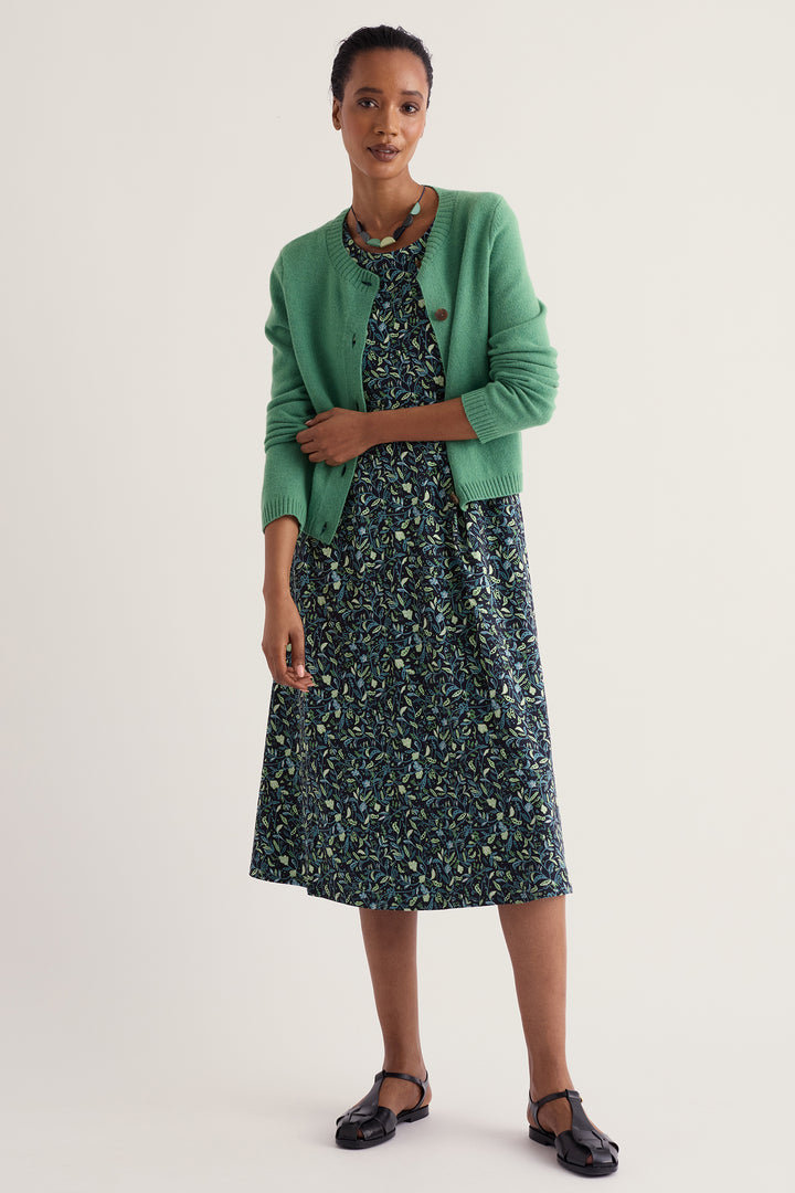 Seasalt Cornwall Veronica Garden Peas Maritime Navy Dress WM32710 38406, worn with a green cardigan