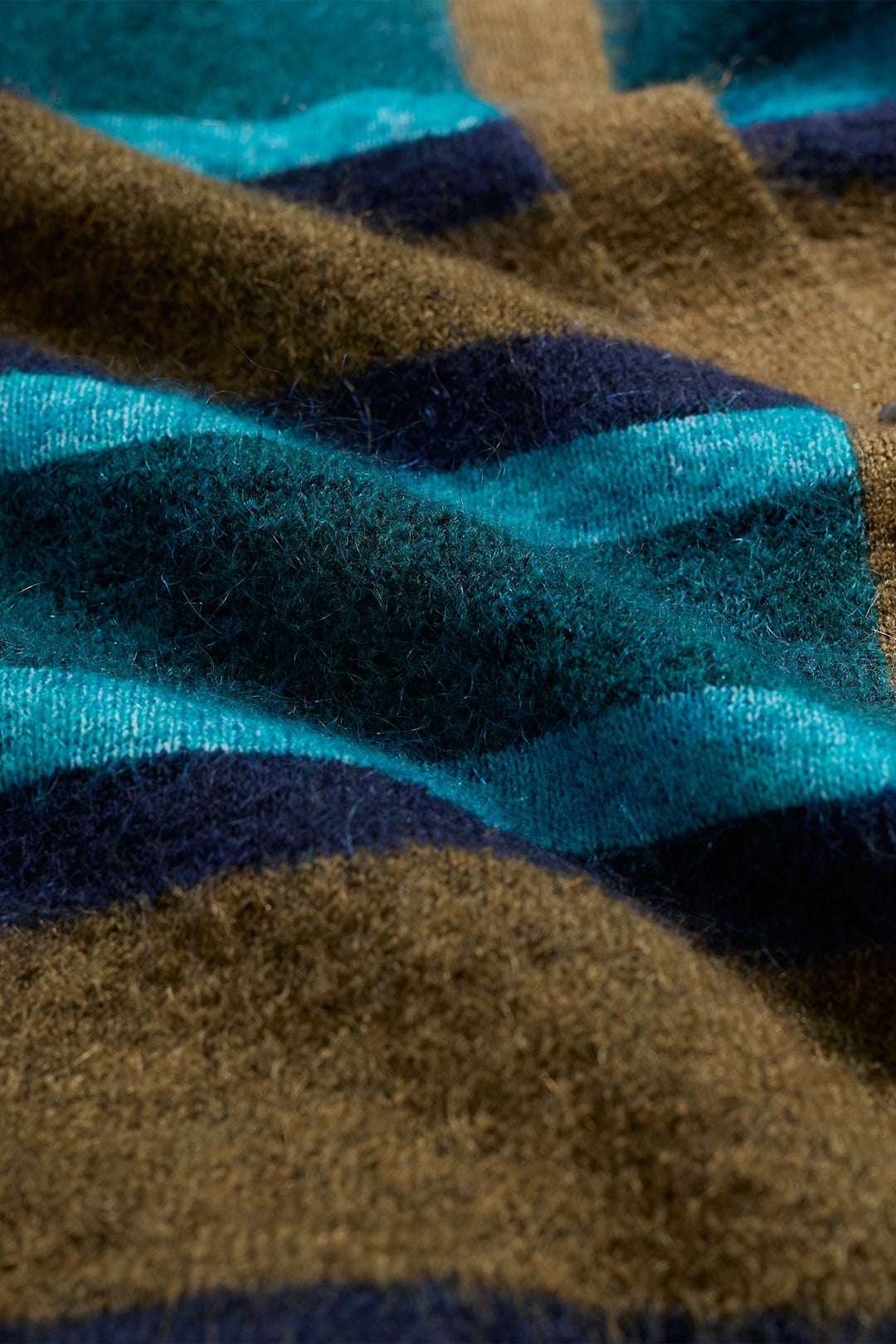 Close-up of fabric with blue, brown, and black stripes
