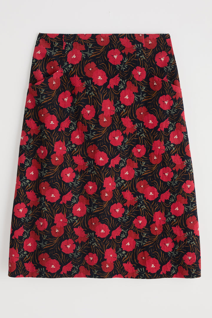 Floral patterned skirt with red flowers on a black background