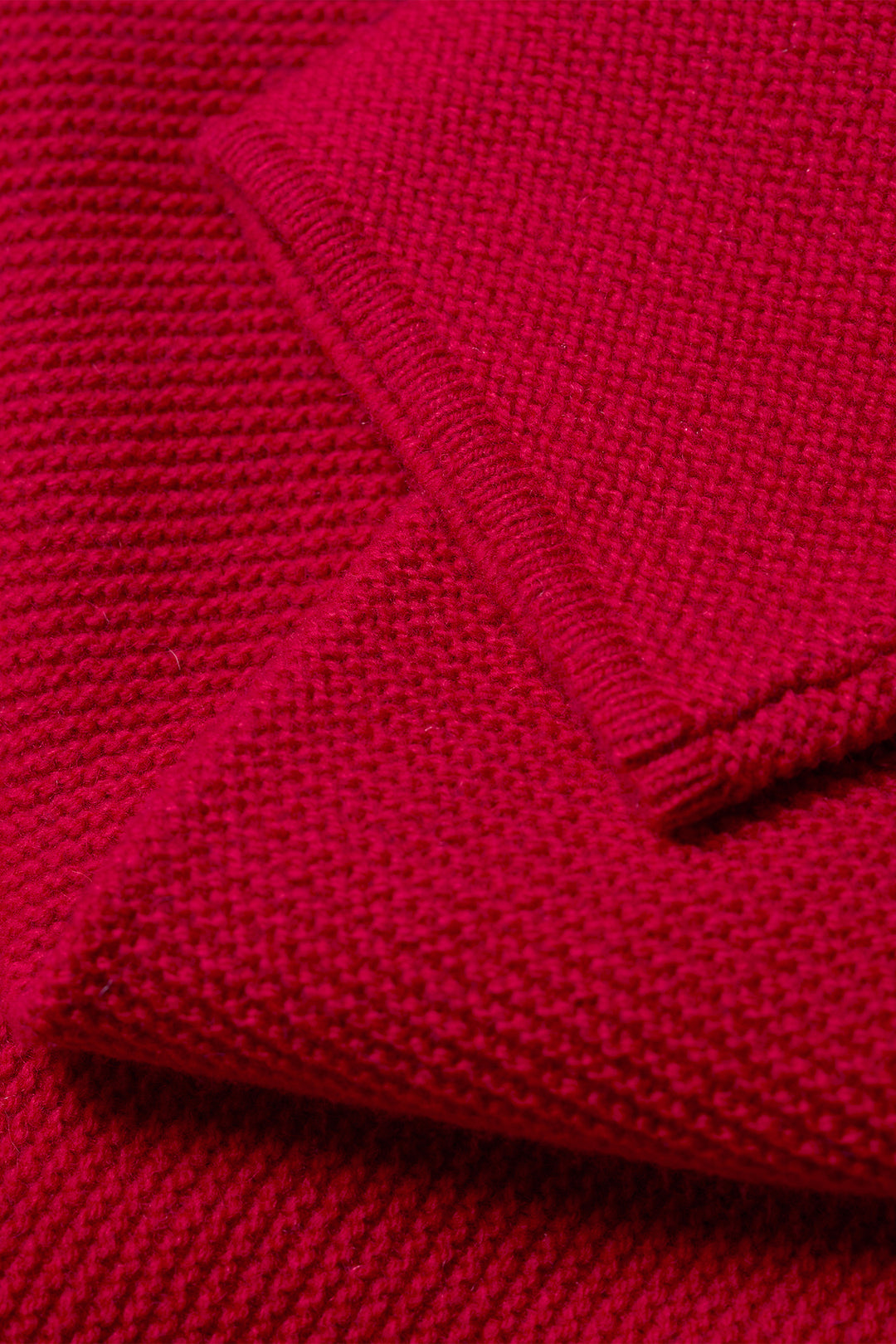 Close-up of a red knitted fabric texture
