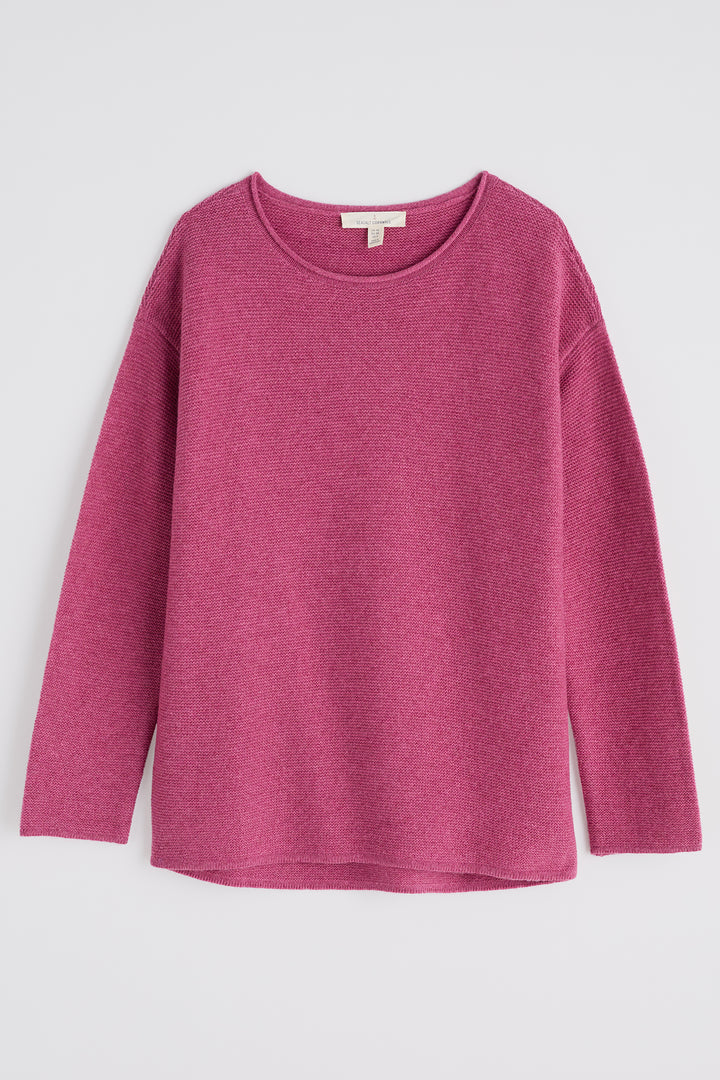 Pink sweater on a light gray background
