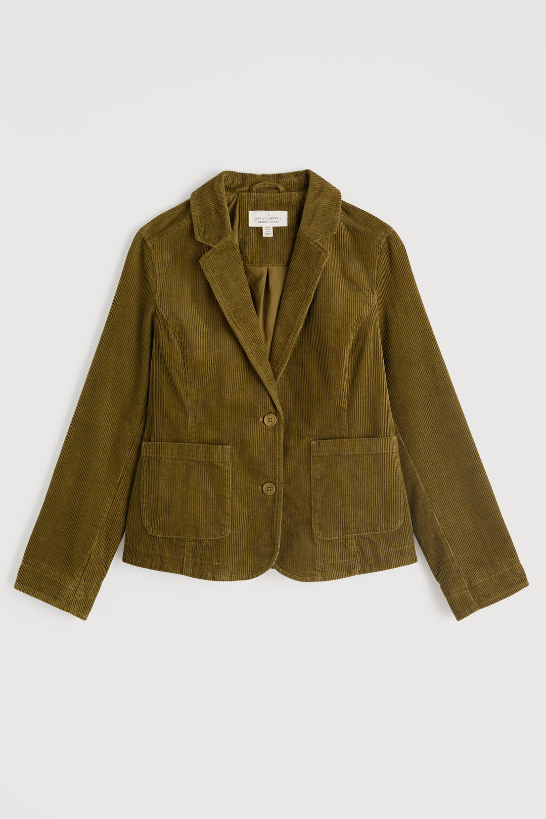 Green blazer on a light gray background