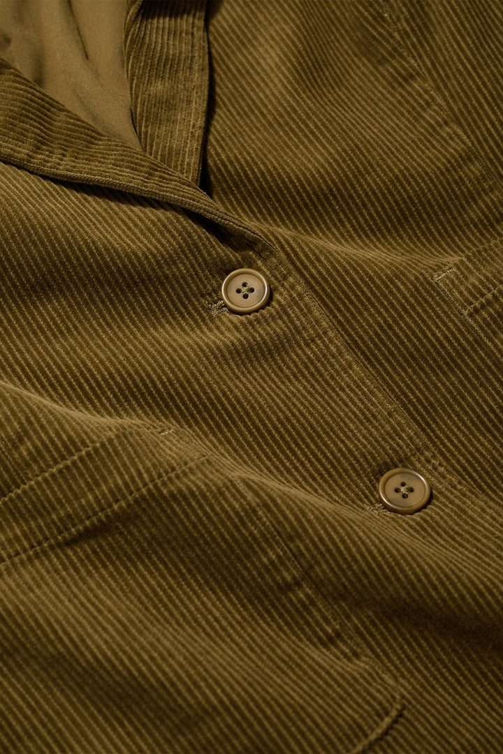 Close-up of a brown corduroy shirt with buttons