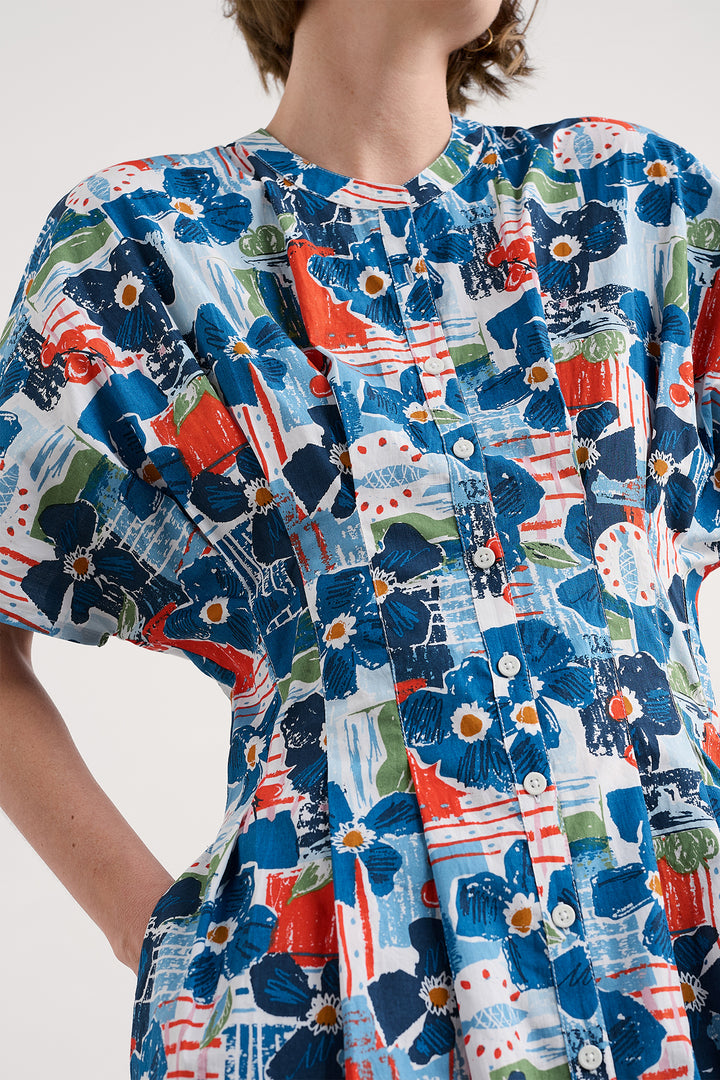 Close-up of a colorful floral dress with a white background
