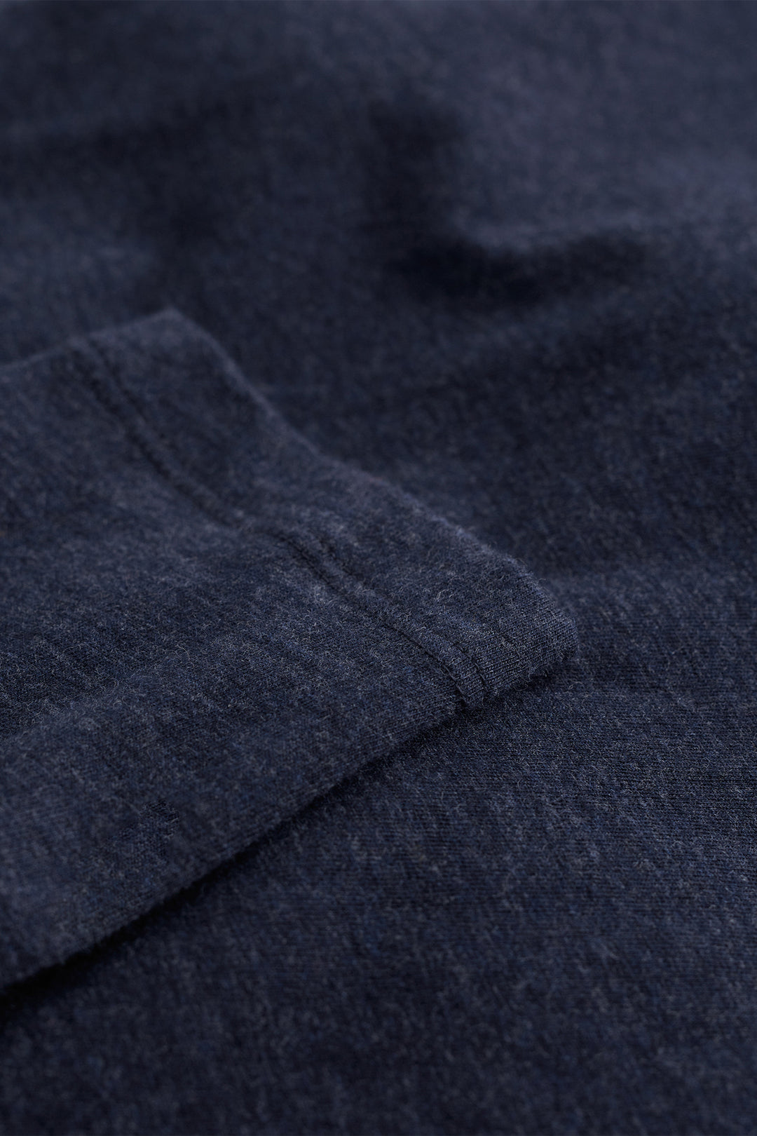 Close-up of dark blue fabric with a textured pattern