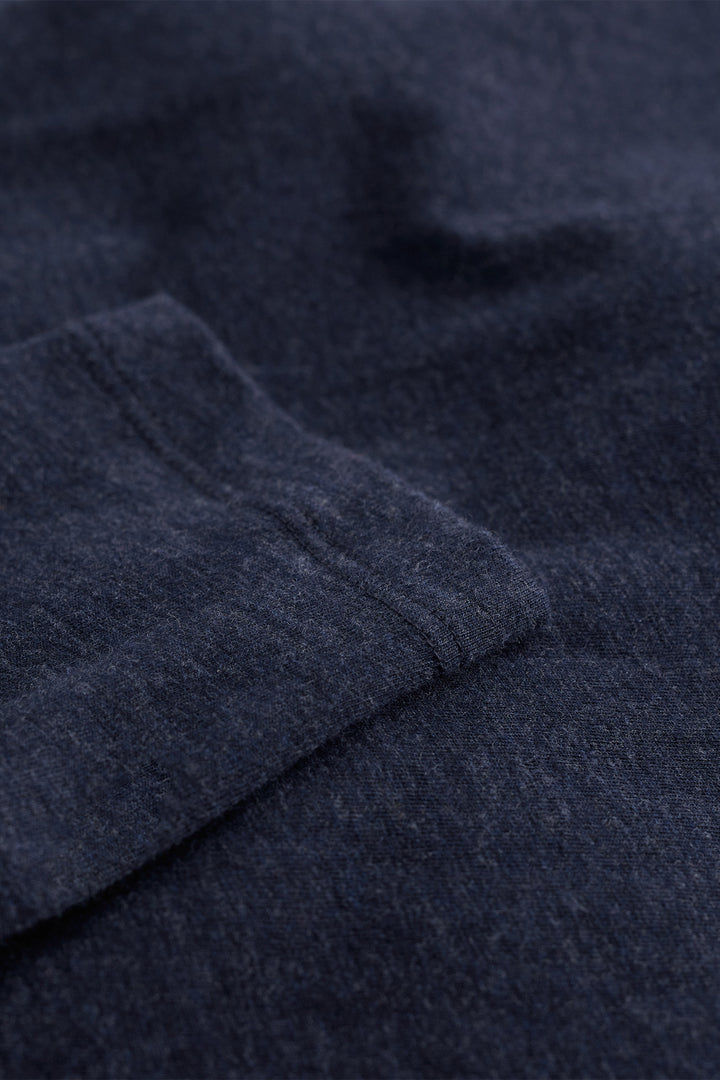 Close-up of dark blue fabric with a textured pattern