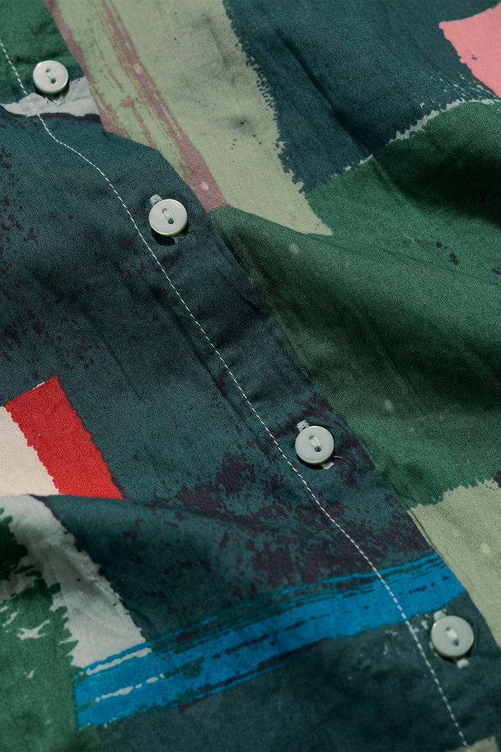 Close-up of a camouflage-patterned shirt with buttons