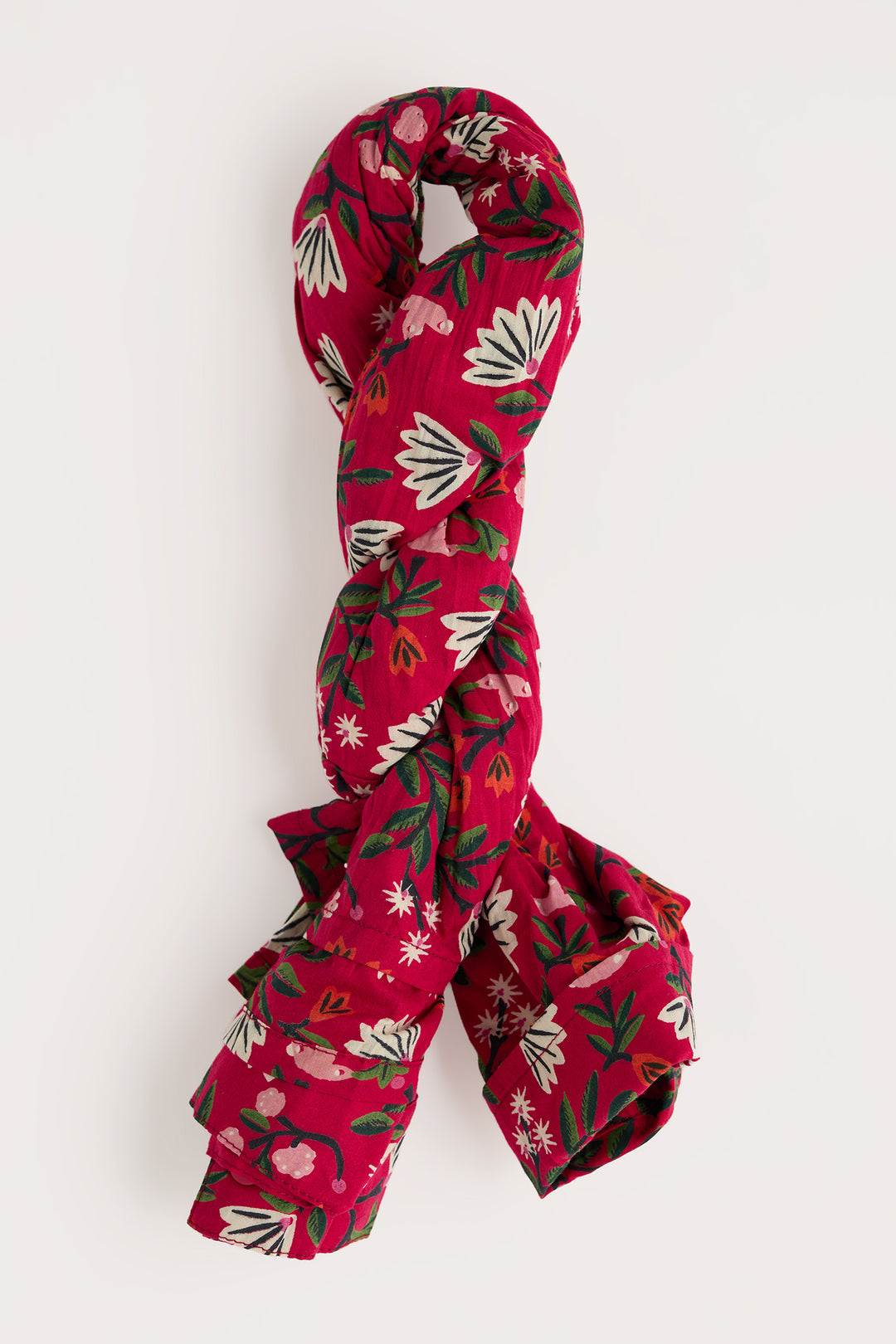 Red floral patterned scarf on a white background