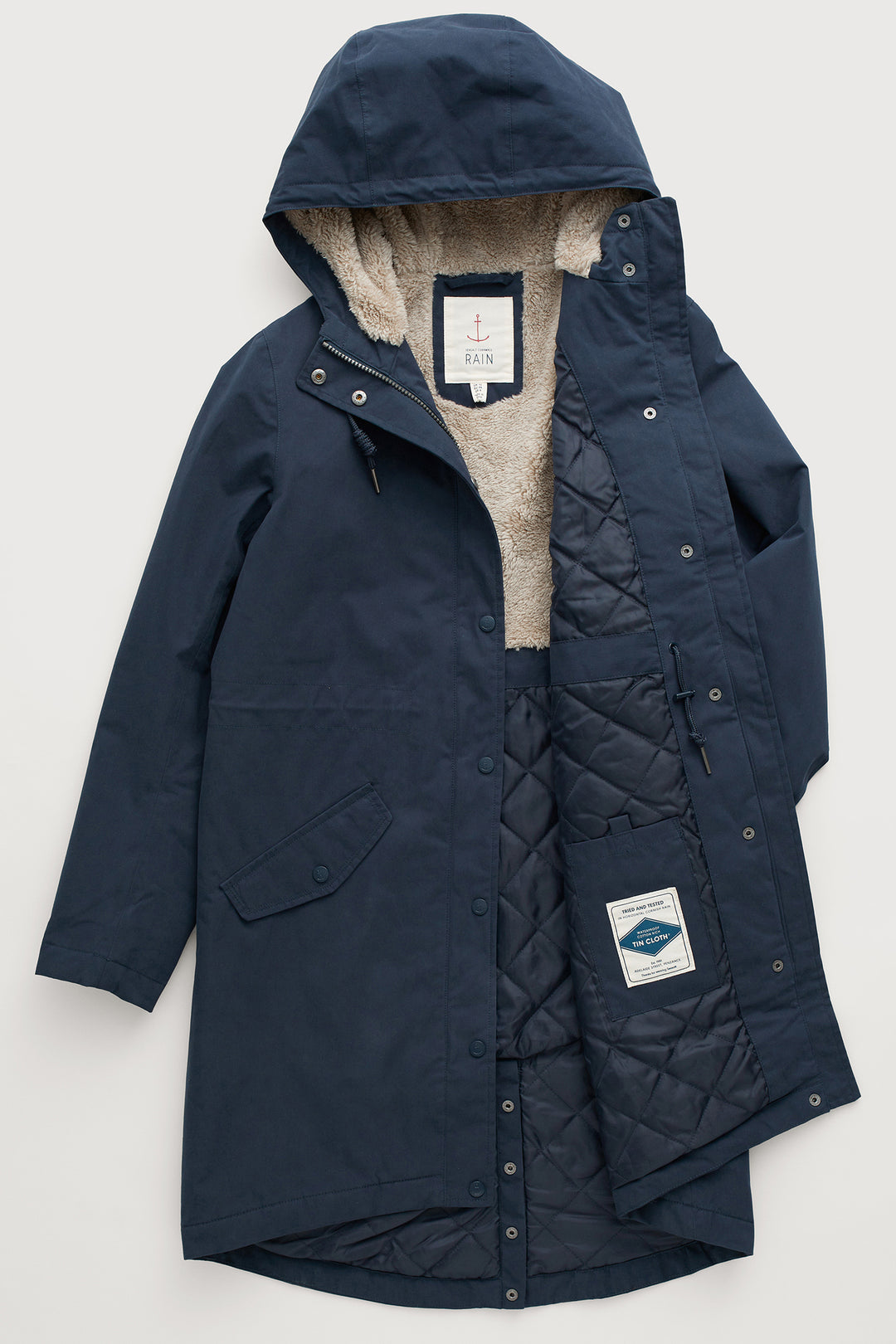 Navy blue coat with beige lining on a light gray background