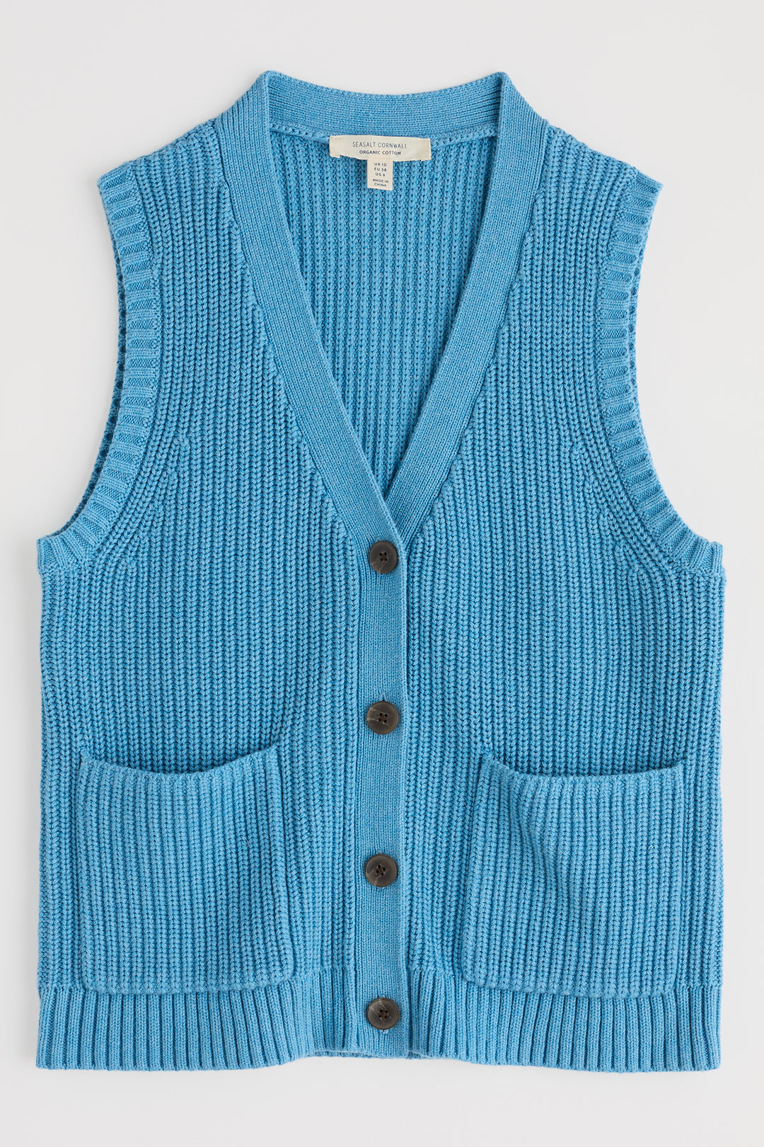 Blue knitted vest with buttons on a white background