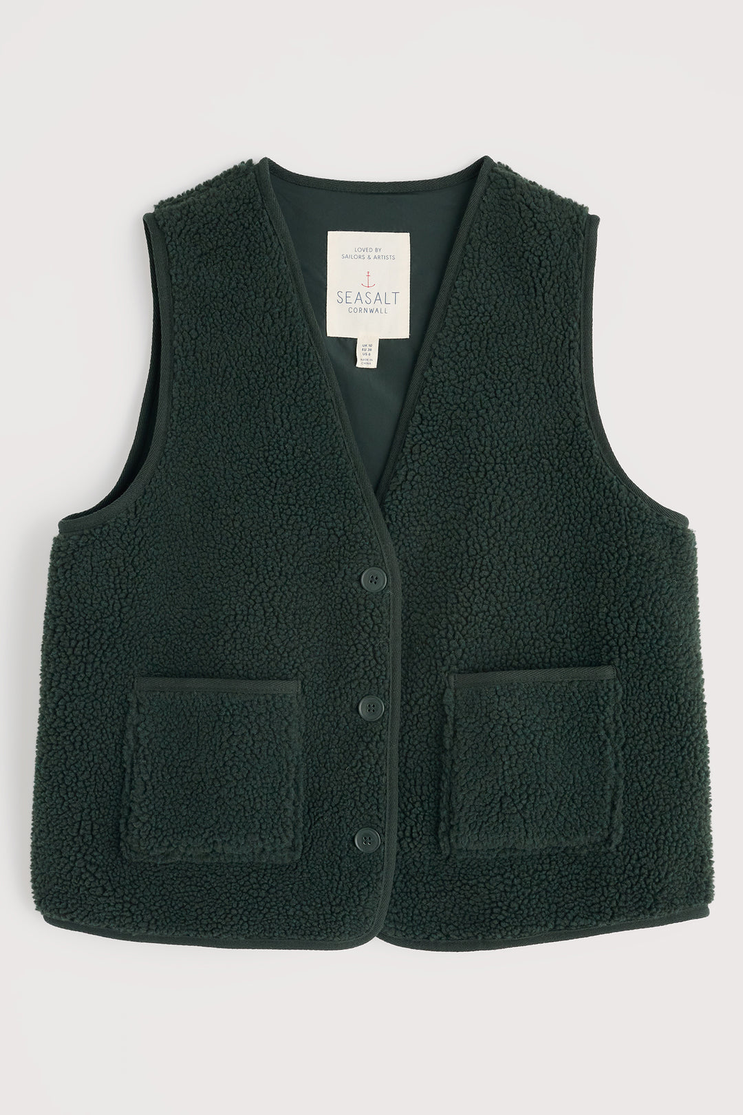 Dark green fleece vest with button details on a light gray background