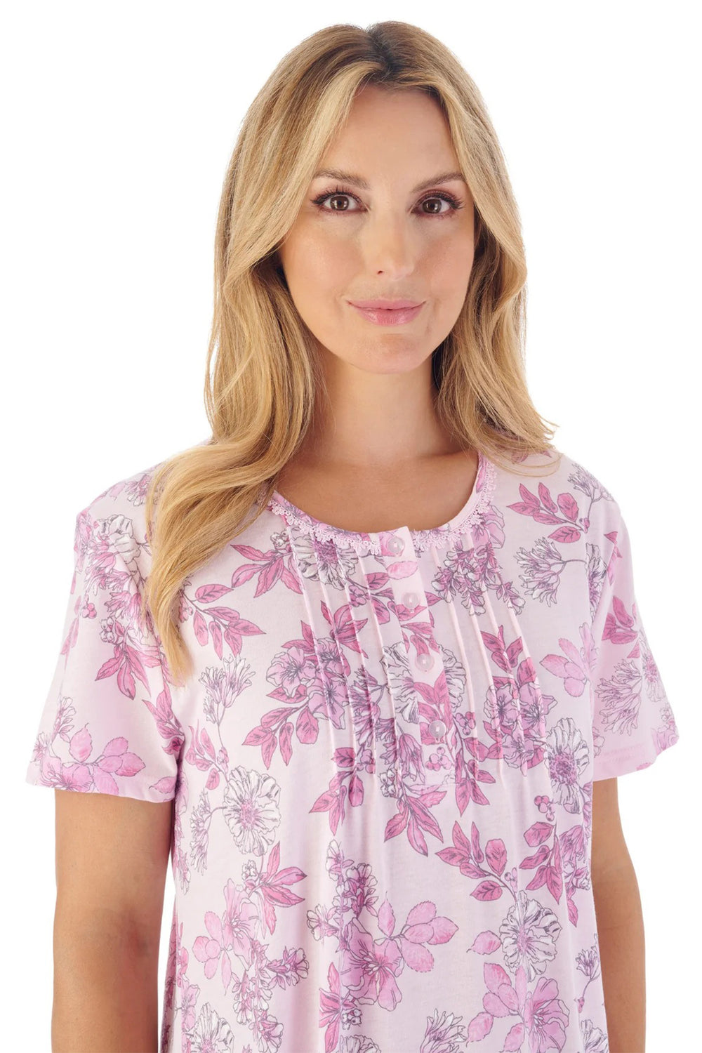 Woman wearing a pink floral blouse on a white background