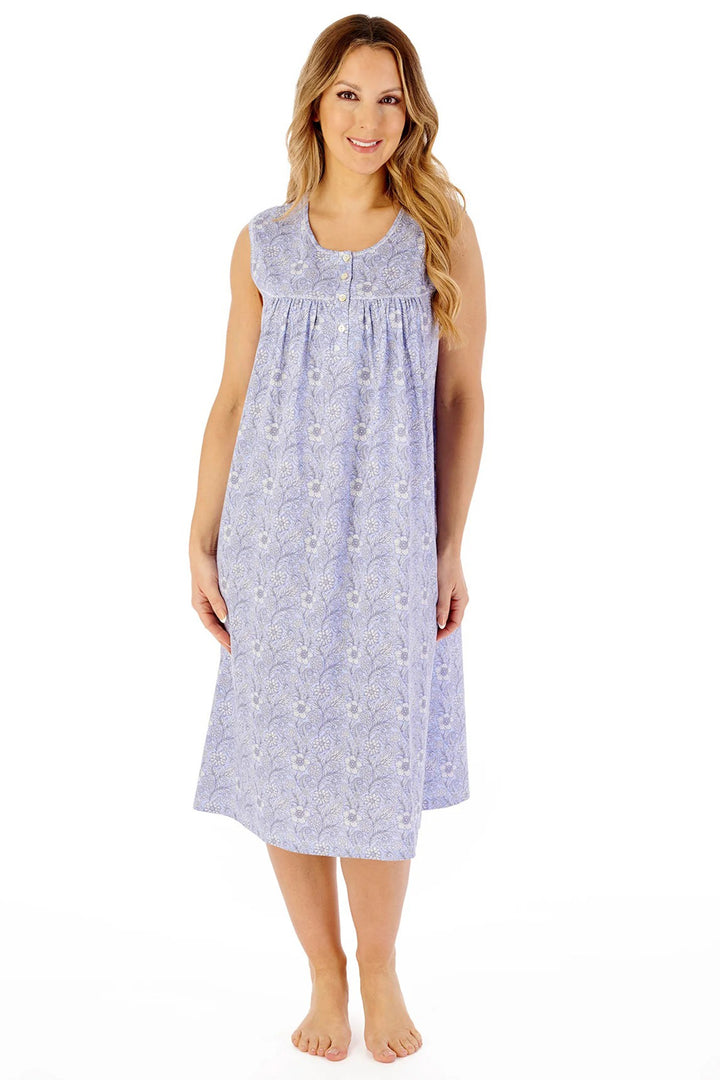 Woman wearing a floral nightgown on a white background