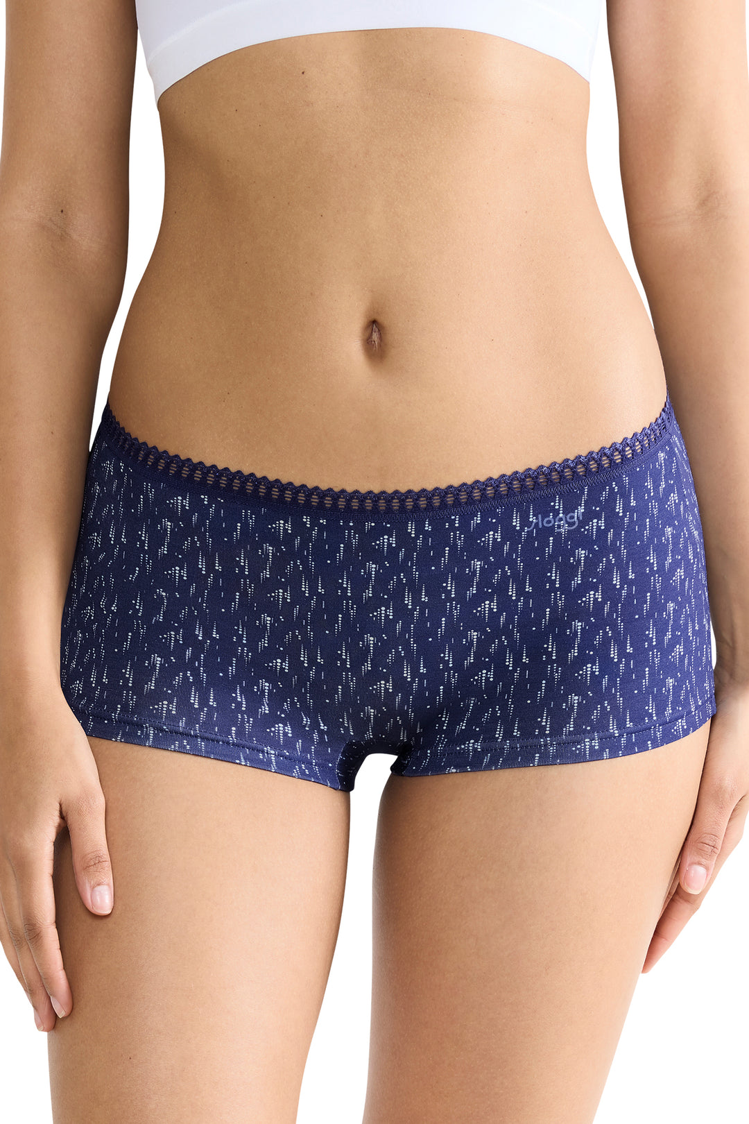 Navy blue patterned underwear worn by a person on a white background