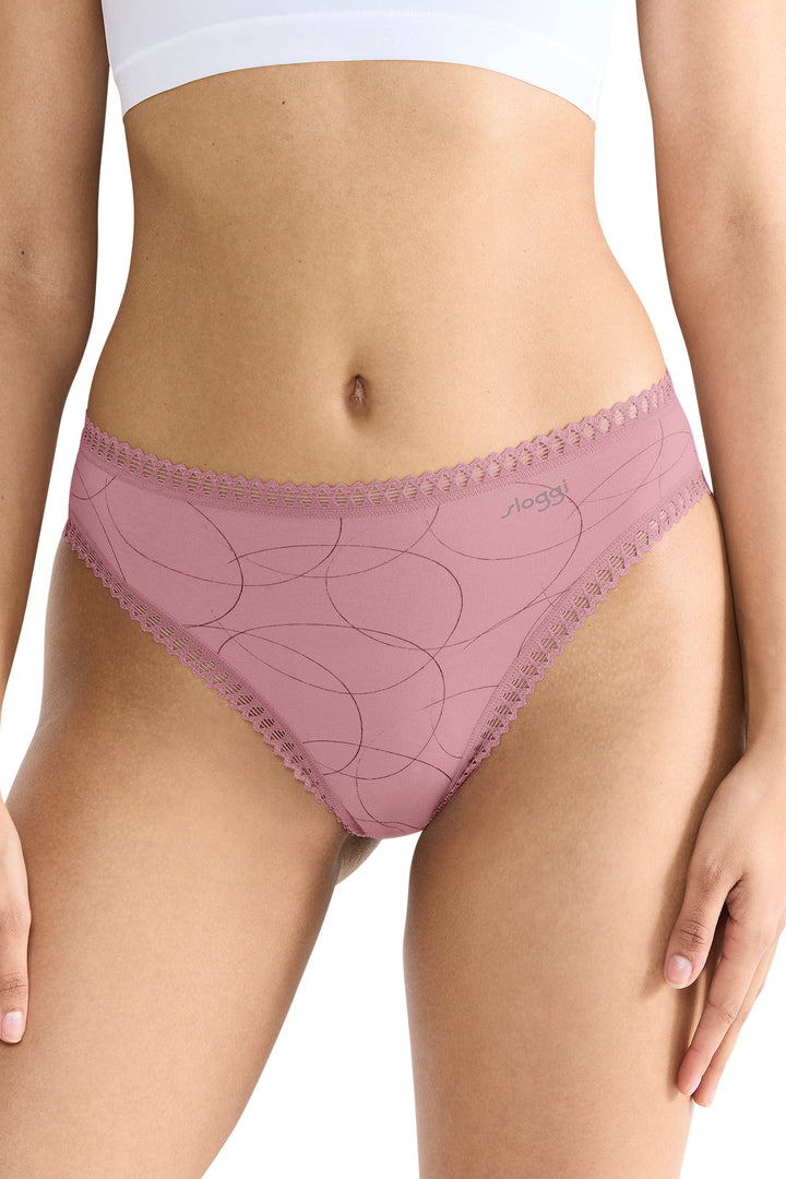 Pink lace underwear worn by a person on a white background