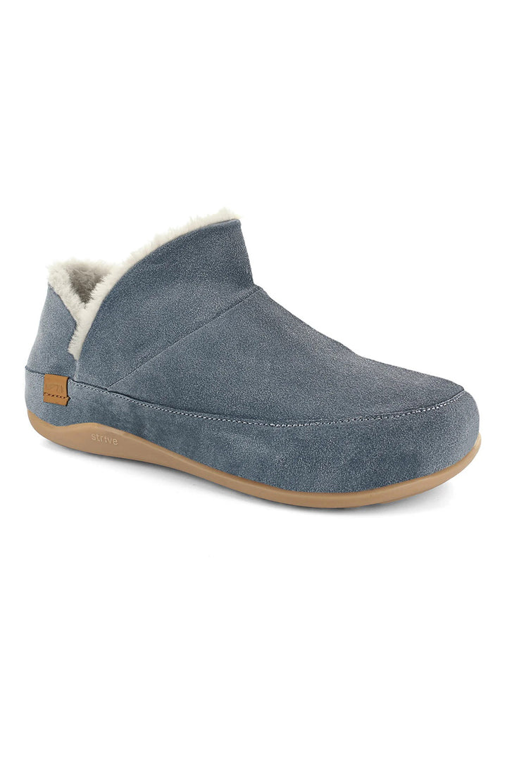 Grey slip-on shoe with shearling lining on a white background