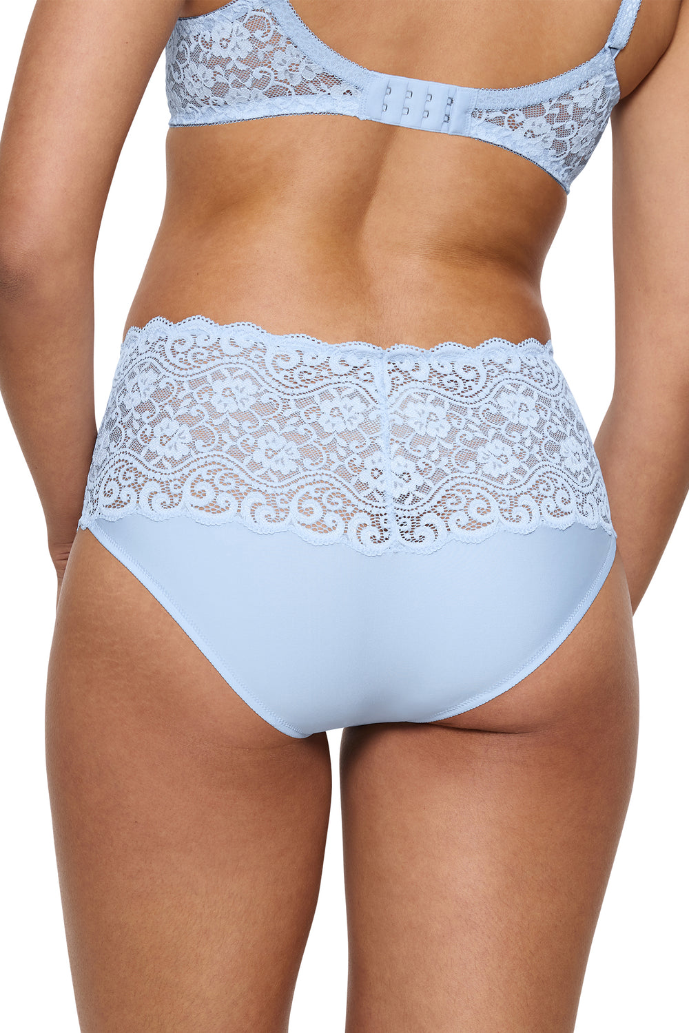 Light blue lace lingerie set on a plain background
